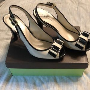 Off white and black patent leather pumps